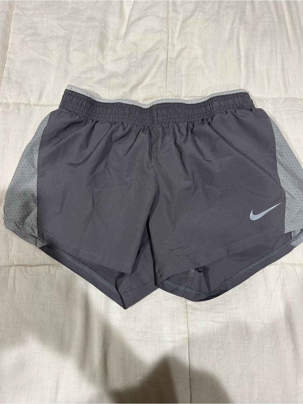 Nike Women’s Charcoal Gray Athletic Running Shorts with Light Gray Accents